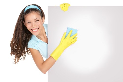 Cleaner working in a Harringay office kitchen and shared space