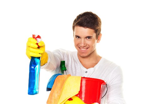 Cleaner maintaining a kitchen and bathroom during a recurring visit